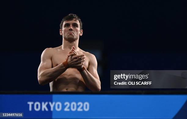 Britain's Thomas Daley competes in the preliminary round of the men's 10m platform diving event during the Tokyo 2020 Olympic Games at the Tokyo...
