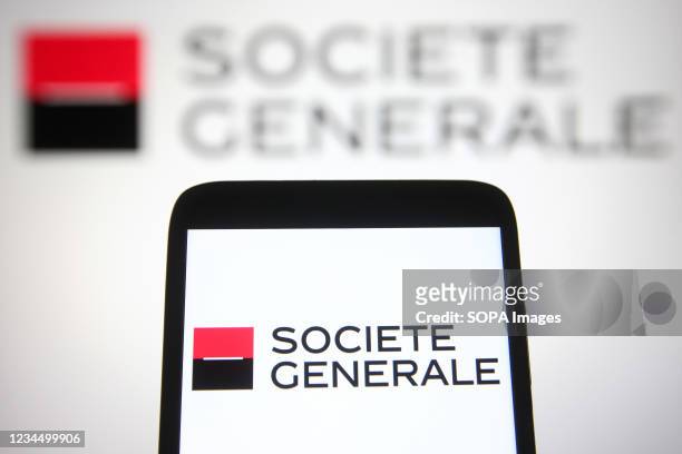 In this photo illustration a Societe Generale logo of a French multinational investment bank and financial services company is seen on a smartphone...