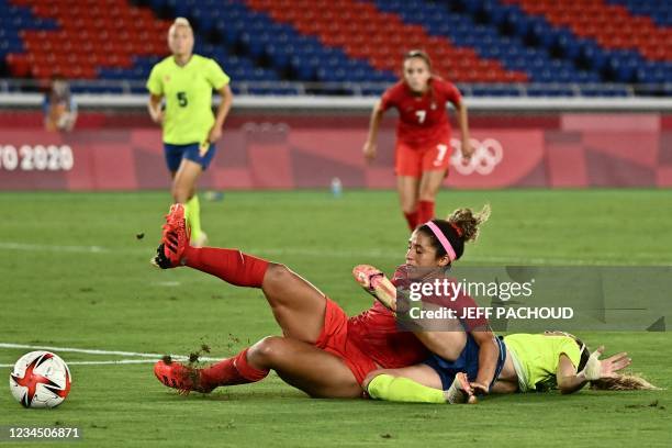 Canada's midfielder Desiree Scott fights for the ball with Sweden's midfielder Kosovare Asllani during the Tokyo 2020 Olympic Games women's final...