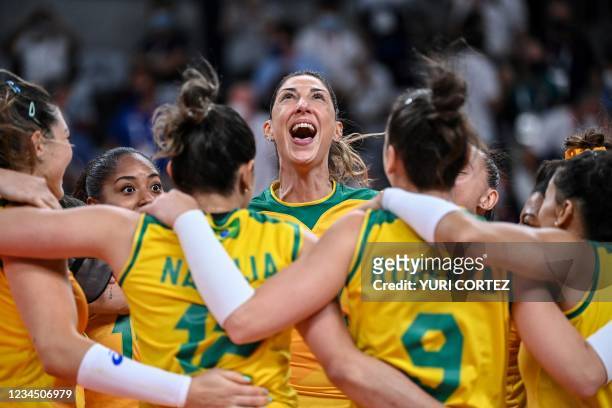 Brazil's Caroline de Oliveira Saad Gattaz and teammates celebrate their victory in the women's semi-final volleyball match between Brazil and South...