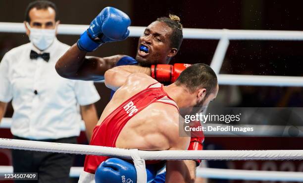 Muslim Gadzhimagomedov of Russian Olympic Committee and Julio La Cruz of Cuba compete in the Men's Heavy Final Bout between the Russian Olympic...