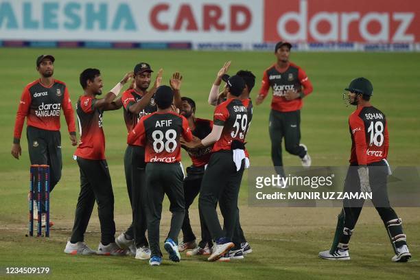 Bangladesh's players celebrate after the dismissal of Australia's Matthew Wade during third Twenty20 international cricket match between Bangladesh...