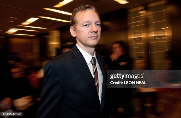 Founder of the Wikileaks website Julian Assange arrives for a press conference on October 23, 2010 during a press conference at the Park Plaza hotel...