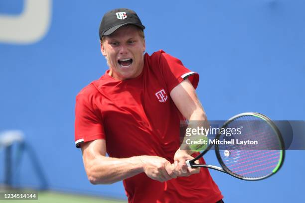Jenson Brooksby of the United States returns a shot during a quarter final match against John MIllman of Australia on Day 7 during the Citi Open at...