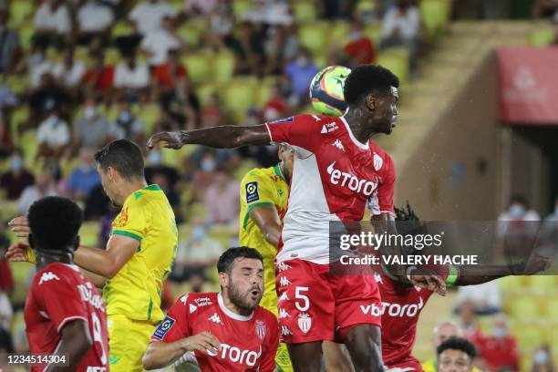 Nantes' French-Cameroonian defender Jean-Charles Castelletto heads the ball and scores his team's first goal during the French L1 football match...