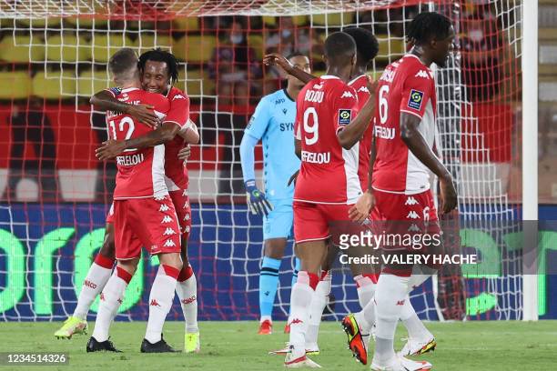 Monaco's Portugese midfielder Gelson Martins celebrates with teammates after scoring his team's first goal during the French L1 football match...