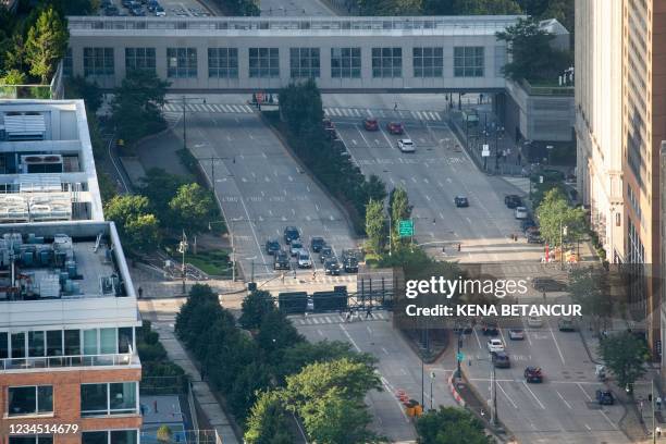 Aerial view shows traffic stopped at a crosswalk on West Street in New York City on August 5, 2021. - President Joe Biden's plan for a $1.2 trillion...