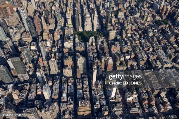 An aerial general view shows the city skyline of Midtown Manhattan, New York on August 5, 2021.