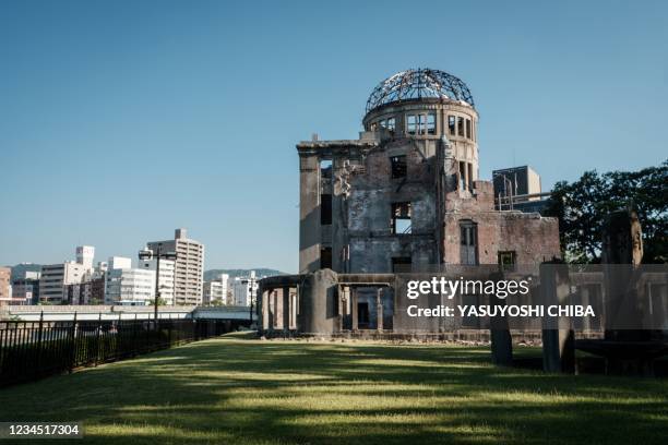 This photo taken on August 6, 2021 shows a general view of the Hiroshima Prefectural Industrial Promotion Hall, as it was known before 1945, and now...