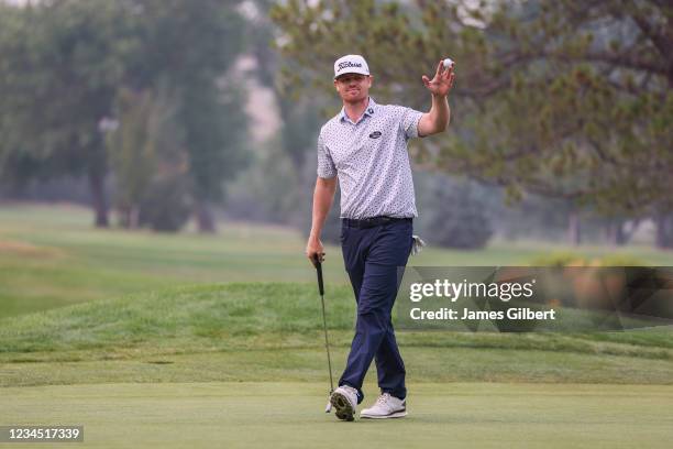 Patrick Fishburn acknowledges the crowd after sinking his putt on the 18th green during the second round of the Utah Championship presented by Zions...