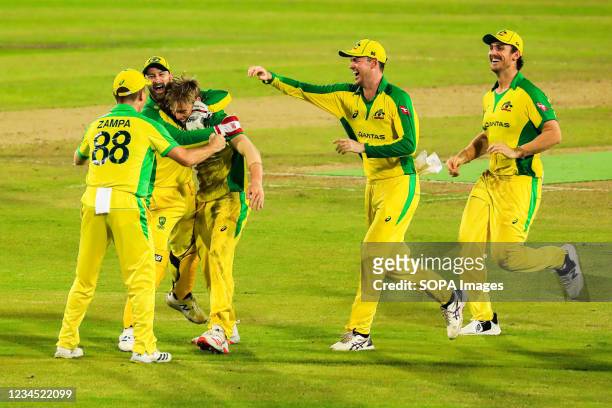Australian cricket player Nathan Ellis celebrates with teammates during the Third T20 match between Australia cricket team and Bangladesh at Sher e...