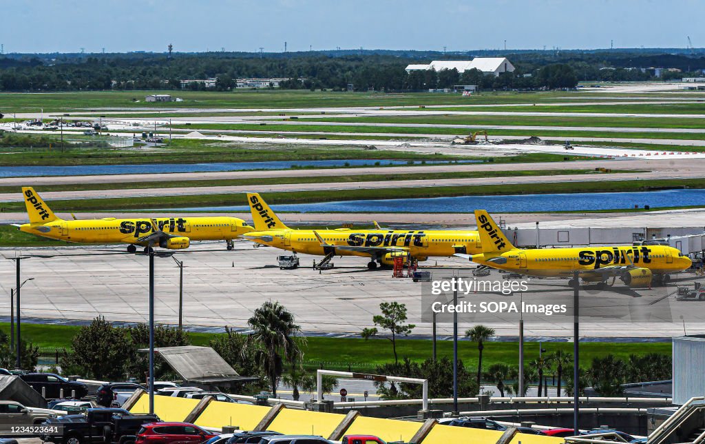 Spirit Airlines aircraft are seen at Orlando International...