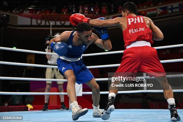 Philippines' Carlo Paalam and Britain's Galal Yafai fight during their men's fly boxing final bout during the Tokyo 2020 Olympic Games at the...