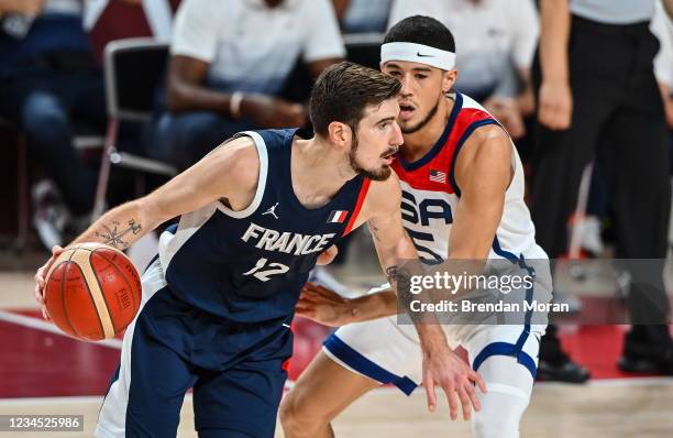 Tokyo , Japan - 7 August 2021; Nando de Colo of France in action against Devin Booker of USA during the men's gold medal match between the USA and...