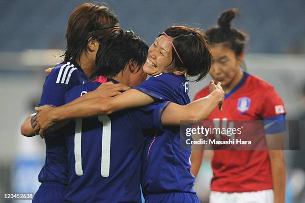 Nahomi Kawasumi of Japan congratulates Shinobu Ohno for her goal during the London 2012 Olympic Women's Football Asian Qualifier match between South...