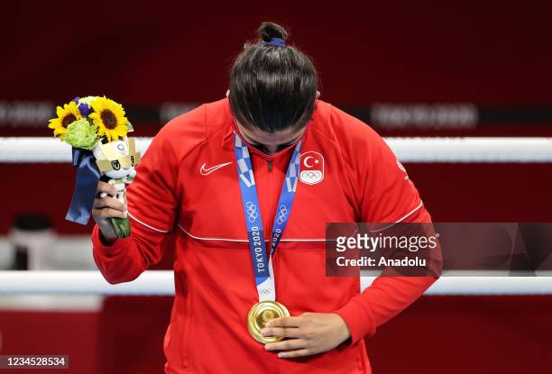 Golden medalist Busenaz Surmeneli of Turkey poses with her gold medal as she celebrates her victory after competing against Hong Gu of China at the...