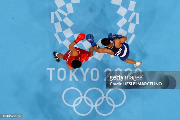 An overview shows Philippines' Carlo Paalam and Britain's Galal Yafai fighting during their men's fly boxing final bout during the Tokyo 2020 Olympic...