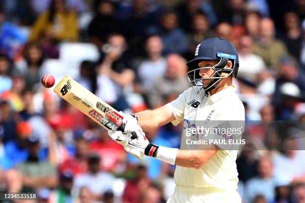 England's captain Joe Root taps the ball away from the wicket on the fourth day of the first cricket Test match of the India Tour of England 2021...