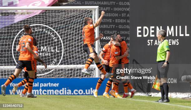 Jamie Robson of Dundee United celebrates his goal with team-mates during the Cinch Scottish Premiership match between Dundee United and Rangers FC at...