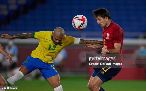 Dani Alves of Brazil and Mikel Oyarzabal of Spain battle for the ball during the Men's Gold Medal Match between Brazil and Spain on day fifteen of...
