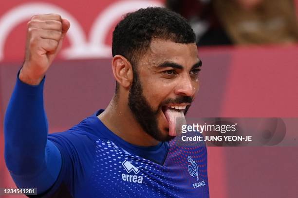 France's Earvin Ngapeth reacts after a point in the men's gold medal volleyball match between France and Russia during the Tokyo 2020 Olympic Games...