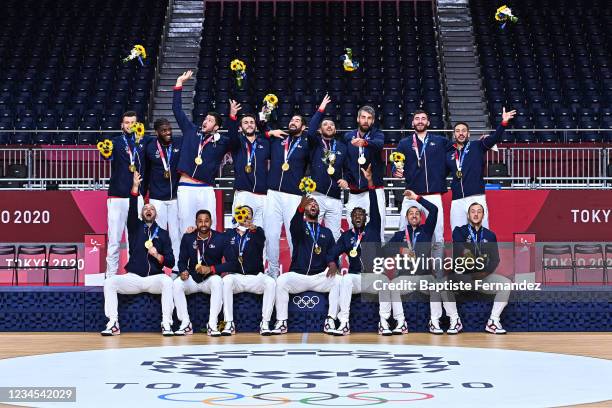 Team of France celebrate on the podium after the Tokyo 2020 Olympic Games Men's Final Handball match between France and Denmark at Yoyogi National...