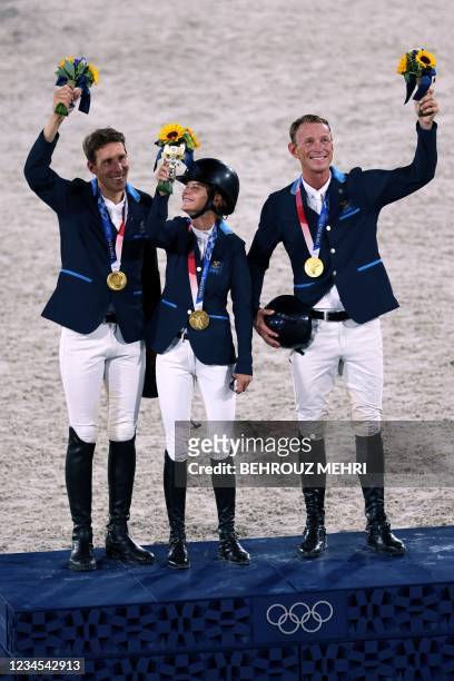 Gold medallists Henrik von Eckermann, Malin Baryard-Johnsson and Peder Fredricson of Sweden pose on the podium during the medal ceremony of...