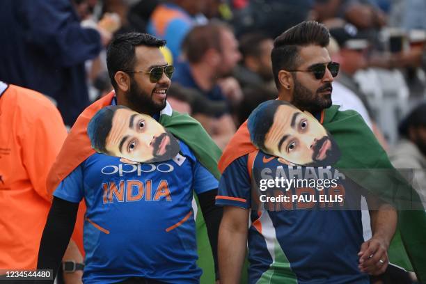 Spectators enjoy the action on the fourth day of the first cricket Test match of the India Tour of England 2021 between England and India at the...