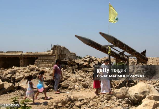 Women and children visit the ruins of the Khiam detention centre in the village of the same name on the border with Israel, on August 7 formerly run...