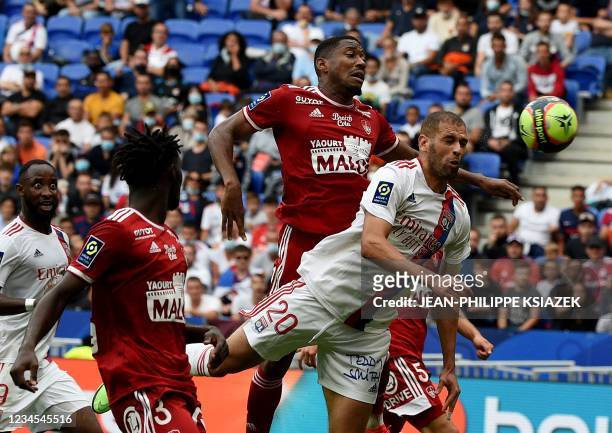 Brest's French defender Pierre-Gabriel Ronael fights for the ball with Lyon's Algerian forward Islam Slimani during the French L1 football match...
