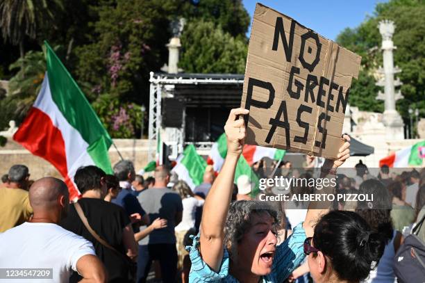 Members of the 'No Vax' take part in a demonstration against the introduction of a mandatory "green pass" in the aim to limit the spread of the...