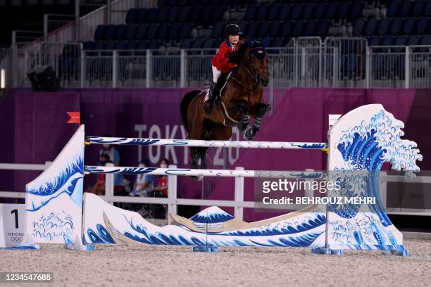 Jessica Springsteen of the US riding Don Juan van de Donkoeve in the equestrian's jumping team finals during the Tokyo 2020 Olympic Games at the...