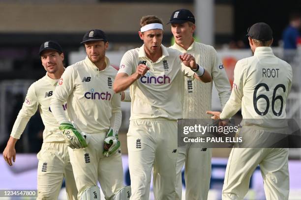 England's Stuart Broad celebrates taking the wicket of India's KL Rahul on the fourth day of the first cricket Test match of the India Tour of...