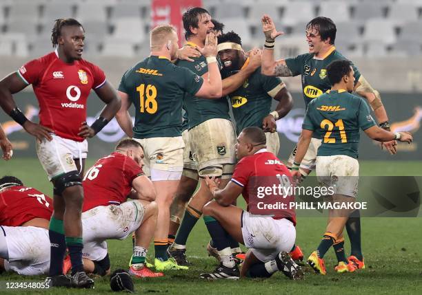 South Africa's players including South Africa's blindside flanker and captain Siya Kolisi celebrate after victory in the third rugby union Test match...