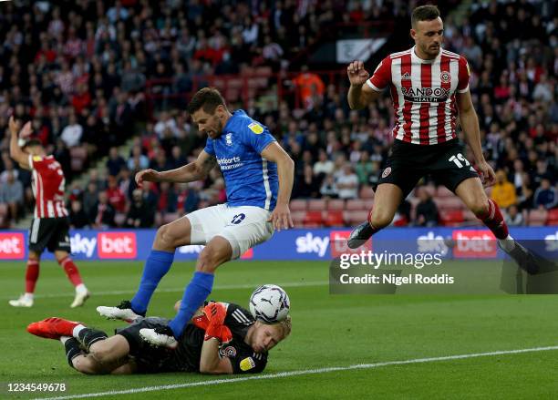 Lukas Jutkiewicz of Birmingham City challenges Jack Robinson and Aaron Ramsdale of Sheffield United during the Sky Bet Championship match between...