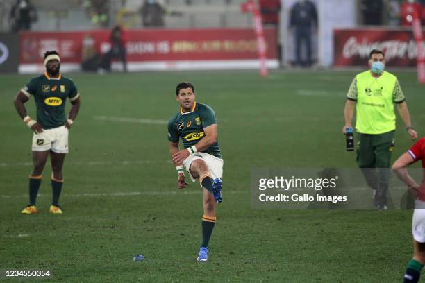 Morne Steyn of South Africa kicks the winning penalty in the match with South Africa captain Siya Kolisi and South African Director of Rugby Rassie...