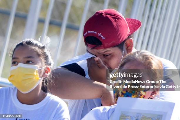 He showed us what family is, Riverside resident Jason Villalobos, center, says of his dad Santos Pablo Villalobos during a march honoring those who...