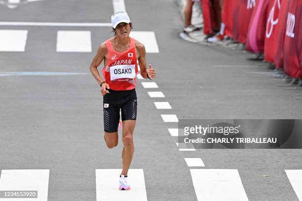 Japan's Suguru Osako runs to the finish line in the men's marathon final during the Tokyo 2020 Olympic Games in Sapporo on August 8, 2021.