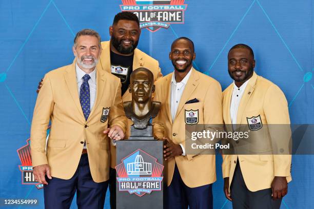 Kurt Warner, Orlando Pace, Isaac Bruce and Marshall Faulk pose during the induction ceremony at the Pro Football Hall of Fame on August 7, 2021 in...