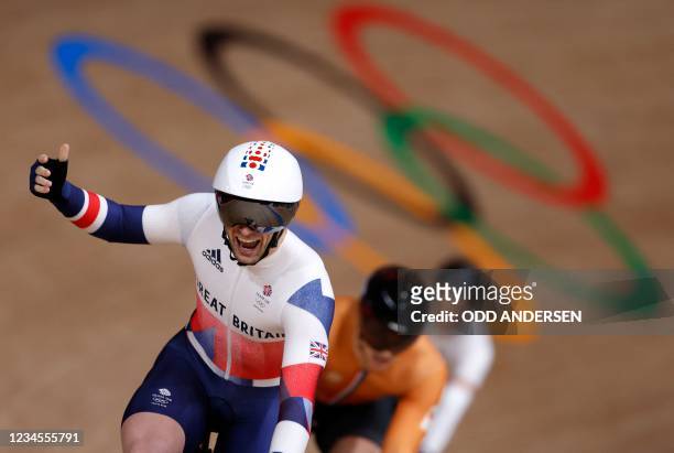 Britain's Jason Kenny celebrates taking gold in the men's track cycling keirin final during the Tokyo 2020 Olympic Games at Izu Velodrome in Izu,...