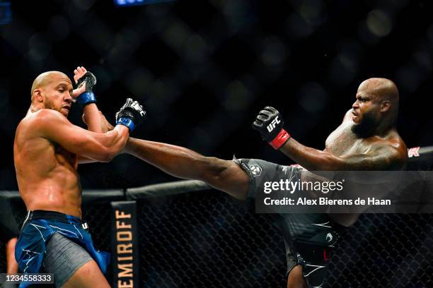 Derrick Lewis kicks Ciryl Gane during their Heavyweight bout at Toyota Center on July 7, 2021 in Houston, Texas.