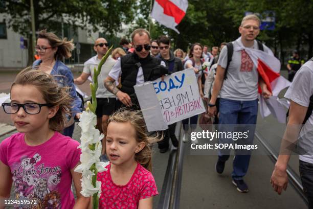 Young protesters taking part during the demonstration. 1 year anniversary march for Belarus. A protest march from the Malieveld to the Belarus...