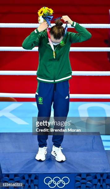 Tokyo , Japan - 8 August 2021; Kellie Harrington of Ireland puts on her her gold medal during the medal ceremony after defeating Beatriz Ferreira of...
