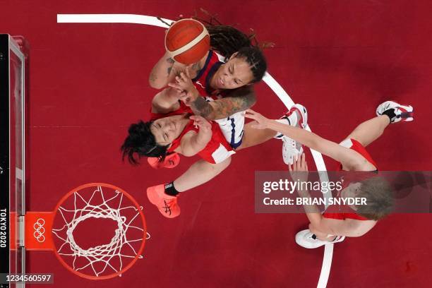 S Brittney Griner goes to the basket past Japan's Himawari Akaho and Maki Takada in the women's final basketball match between USA and Japan during...