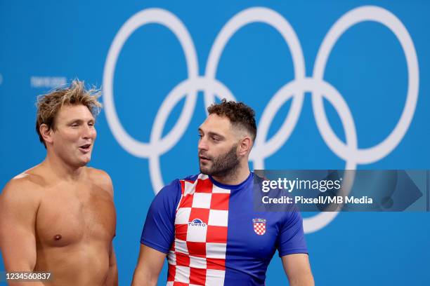 Paulo Obradovic of Team Croatia and Jesse Smith of Team United States talk after the Mens Classification 5th-6th match between Croatia and the United...