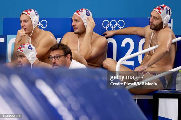 Lovre Milos, Andro Buslje and Paulo Obradovic of Team Croatia reacts during the Mens Classification 5th-6th match between Croatia and the United...