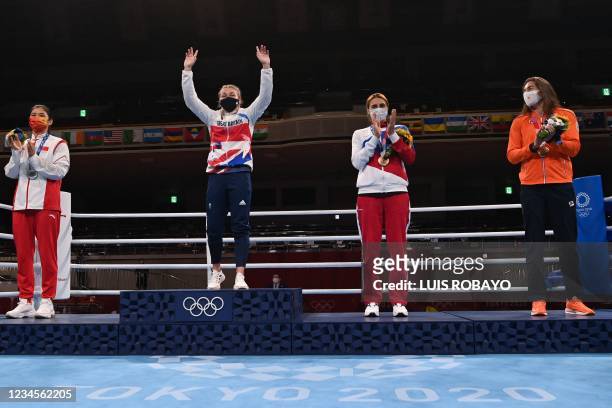 (LtoR Silver medallist China's Li Qian, gold medallist Britain's Lauren Price, bronze medallists Netherlands' Nouchka Fontijn and Russia's Zenfira...
