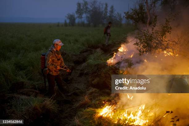 Extinguishing works continue for the wildfire in the village of Kuel in Yakutia, Sakha, Russia on August 08, 2021.