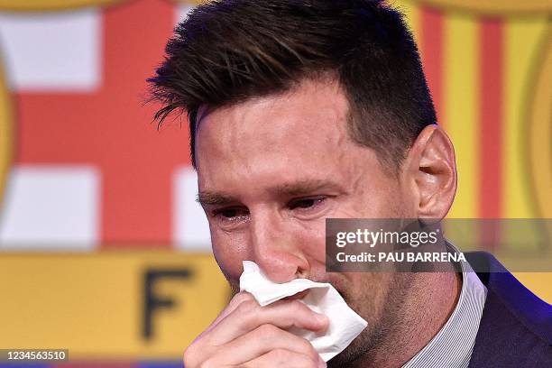 Barcelona's Argentinian forward Lionel Messi cries at the start of a press conference at the Camp Nou stadium in Barcelona on August 8, 2021. - The...