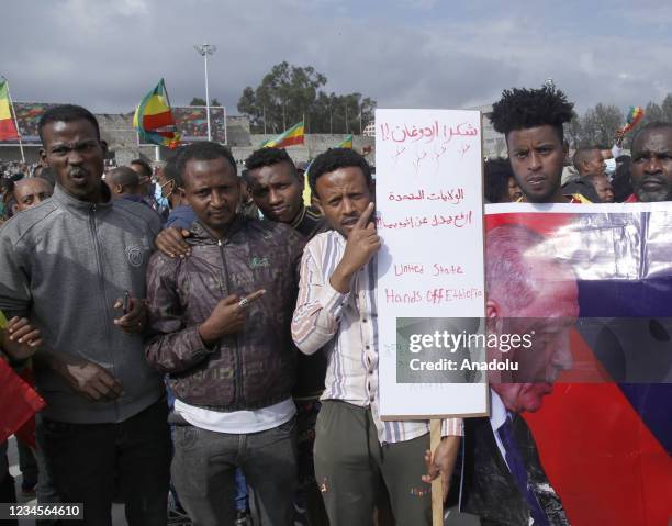 Ethiopians hold up the poster of Turkish President Recep Tayyip Erdogan and Vladimir Putin President of Russia by saying â We thank you Erdogan â...